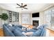 Comfortable living room with a fireplace, built-in shelving, and a large sectional sofa at 12345 Beestone Ln, Raleigh, NC 27614