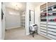 Organized walk-in closet with custom shelving, ample storage space, and a full-length mirror at 12345 Beestone Ln, Raleigh, NC 27614