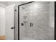 Bathroom features a tiled shower with black hardware at 1410 Joe Louis Ave, Raleigh, NC 27610
