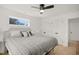 Bright bedroom features hardwood floors, ceiling fan, and large closets at 1410 Joe Louis Ave, Raleigh, NC 27610