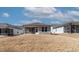 Rear exterior view showcasing a screened-in patio and yard space, blending indoor-outdoor living seamlessly at 1413 Buxus Ct, Fuquay Varina, NC 27526