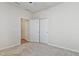 Bright bedroom with a ceiling fan and double doors to the hallway at 1413 Buxus Ct, Fuquay Varina, NC 27526