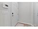 Clean entryway featuring a white door, light walls, and durable wood-look flooring at 1413 Buxus Ct, Fuquay Varina, NC 27526