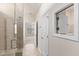 Hallway with view of shower, door to water closet, and bedroom at the end of the hall at 1413 Buxus Ct, Fuquay Varina, NC 27526