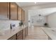 Well-lit kitchen with elegant countertops and a clear view to the adjacent living space at 1413 Buxus Ct, Fuquay Varina, NC 27526