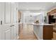 Stylish kitchen featuring an island with a white countertop and seamless flow to the living area at 1413 Buxus Ct, Fuquay Varina, NC 27526