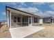 This home has a large concrete patio and screened in porch with neutral vinyl siding at 1413 Buxus Ct, Fuquay Varina, NC 27526