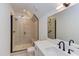 Modern bathroom with a glass enclosed shower, tiled walls, and sleek black hardware at 15 Harvest View Way, Franklinton, NC 27525