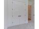 The bedroom features neutral carpet and white trim and walls, as well as a closet at 15 Harvest View Way, Franklinton, NC 27525