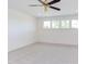 Bright bedroom featuring neutral carpet, a ceiling fan, and well-lit windows at 15 Harvest View Way, Franklinton, NC 27525