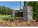 Elegant stone entrance to Harvest View Estates, surrounded by lush landscaping and beautiful greenery at 15 Harvest View Way, Franklinton, NC 27525