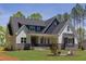 Attractive two-story house showcasing a covered porch and fresh landscaping at 15 Harvest View Way, Franklinton, NC 27525
