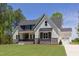 Beautiful home with a well-maintained lawn, two-car garage and appealing modern design at 15 Harvest View Way, Franklinton, NC 27525