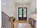Elegant foyer with hardwood floors, wainscoting, and a stylish chandelier at 15 Harvest View Way, Franklinton, NC 27525