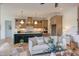 Open concept kitchen, dining, and living area with bright cabinets and a view at 15 Harvest View Way, Franklinton, NC 27525