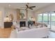Inviting living room featuring a fireplace, large windows, and comfortable seating at 15 Harvest View Way, Franklinton, NC 27525