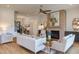 An open living room with a fireplace and bright, natural light at 15 Harvest View Way, Franklinton, NC 27525
