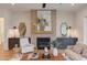 Cozy living room with a tiled fireplace, neutral decor, and ambient lighting at 15 Harvest View Way, Franklinton, NC 27525