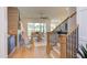 Open-concept living room with wood floors, a fireplace, and access to a covered patio at 15 Harvest View Way, Franklinton, NC 27525