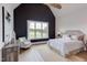 Spacious main bedroom featuring a vaulted ceiling, large windows, and a cozy sitting area with natural light at 15 Harvest View Way, Franklinton, NC 27525