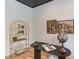 Comfortable office space with a modern desk, globe, bookshelf, and unique decor at 15 Harvest View Way, Franklinton, NC 27525