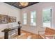 Bright office space with a modern desk, light fixture, and natural light from large windows at 15 Harvest View Way, Franklinton, NC 27525