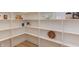 A well-organized and spacious walk-in pantry with shelving at 15 Harvest View Way, Franklinton, NC 27525