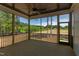 Screened-in patio with ceiling fan and views of the backyard at 15 Harvest View Way, Franklinton, NC 27525