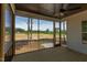 Relaxing screened-in patio with lovely views of the expansive backyard at 15 Harvest View Way, Franklinton, NC 27525