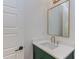 Stylish powder room with a green vanity, gold mirror, and modern fixtures at 15 Harvest View Way, Franklinton, NC 27525
