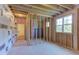 Unfinished room with insulation, framing, door, and windows to the outside at 15 Harvest View Way, Franklinton, NC 27525