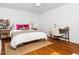 Cozy bedroom with a bed, a workspace, and natural light at 1603 Sutton Dr, Raleigh, NC 27605