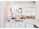 Modern kitchen featuring stylish countertops, stainless steel sink, and an open view to the inviting living area at 1603 Sutton Dr, Raleigh, NC 27605
