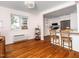 Inviting living room offering hardwood floors, an abundance of natural light, and a clear view of the kitchen area at 1603 Sutton Dr, Raleigh, NC 27605