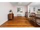 Cozy living room with hardwood floors, ample natural light, and easy access to the kitchen at 1603 Sutton Dr, Raleigh, NC 27605