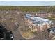 Aerial view of apartment building with covered balconies and surrounding trees at 201 Finsbury St # 302, Durham, NC 27703