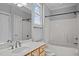 Bathroom with a bathtub, vanity, mirror, and window at 201 Finsbury St # 302, Durham, NC 27703