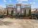 Attractive brick condo building with manicured landscaping, balconies, and ample parking at 201 Finsbury St # 302, Durham, NC 27703