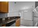 Bright kitchen includes stainless steel appliances and dark granite countertops at 201 Finsbury St # 302, Durham, NC 27703