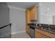 Well-equipped kitchen features granite countertops, stainless steel appliances and neutral cabinets at 201 Finsbury St # 302, Durham, NC 27703