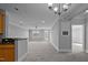Expansive living area with plush carpeting, and a view of the kitchen at 201 Finsbury St # 302, Durham, NC 27703