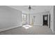 Spacious primary bedroom with carpet, natural light, and access to a bathroom and closet at 201 Finsbury St # 302, Durham, NC 27703