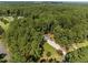Aerial view of home with surrounding lush green landscape at 208 Hardwood Ridge Ct, Clayton, NC 27520