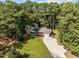 Aerial shot of home surrounded by dense trees offering privacy and seclusion at 208 Hardwood Ridge Ct, Clayton, NC 27520