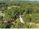 Expansive aerial view of home and large treed lot in a serene, wooded setting at 208 Hardwood Ridge Ct, Clayton, NC 27520
