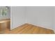 Small room with hardwood floors, a window, and a white wall at 208 Hardwood Ridge Ct, Clayton, NC 27520