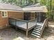 Deck view showing stairs, backyard, and a screened-in porch at 208 Hardwood Ridge Ct, Clayton, NC 27520
