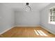 Minimalist dining room featuring modern lighting and wood-look floors at 208 Hardwood Ridge Ct, Clayton, NC 27520