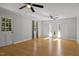 Spacious living room with hardwood floors, ceiling fans, large windows and natural light at 208 Hardwood Ridge Ct, Clayton, NC 27520