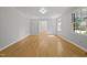 Bright living room with neutral walls and sleek floors, perfect for entertaining at 208 Hardwood Ridge Ct, Clayton, NC 27520